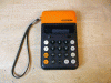 Omron model 86R - ORANGE POCKET CALCULATOR -working well, 1970's