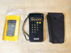 Omron model 88M - POCKET CALCULATOR - vfd display, manual, case